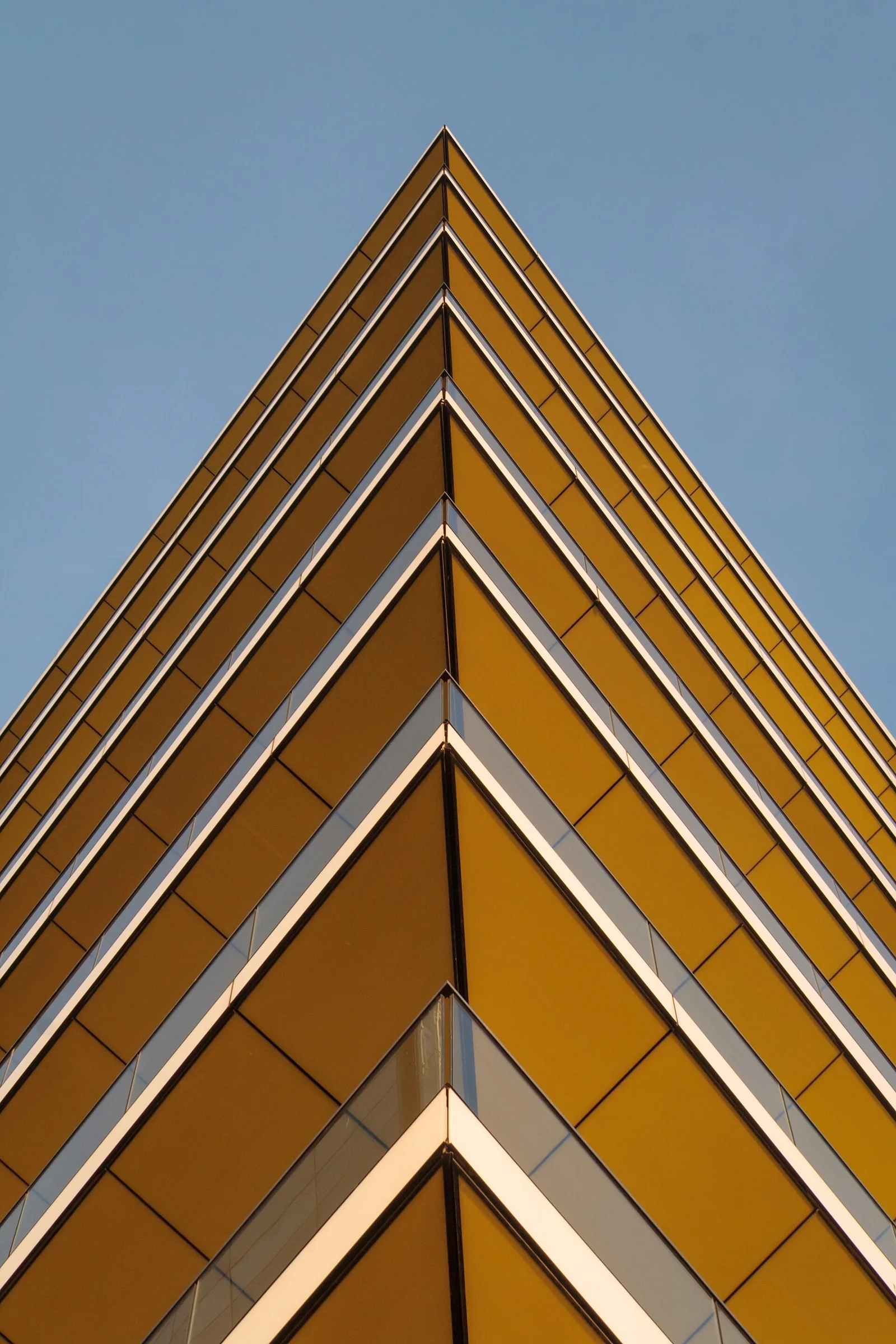 Terracotta-colored balconies seen from the street.